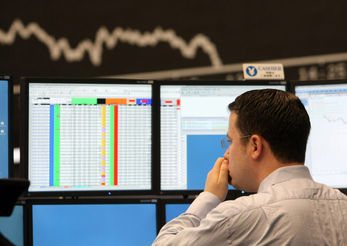 FRANKFURT AM MAIN, GERMANY - SEPTEMBER 15:  A trader rubs his nose during a trading session on the trading floor at Frankfurt stock exchange on September 15, 2008 in Frankfurt, Germany. Due to collapse of U.S. fourth largest investment bank Lehman Brothers Holdings Inc. the German DAX Index fell to the lowest since October 2006.  (Photo by Ralph Orlowski/Getty Images)
